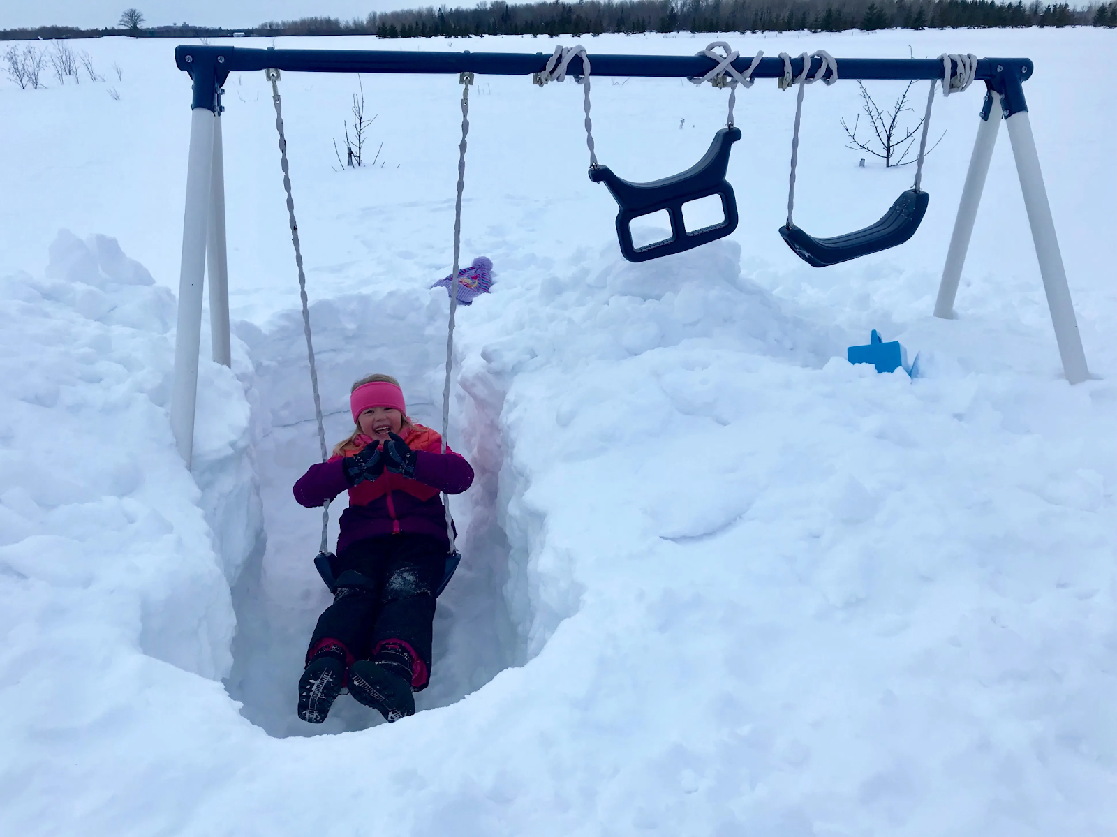 A child playing in the snow.