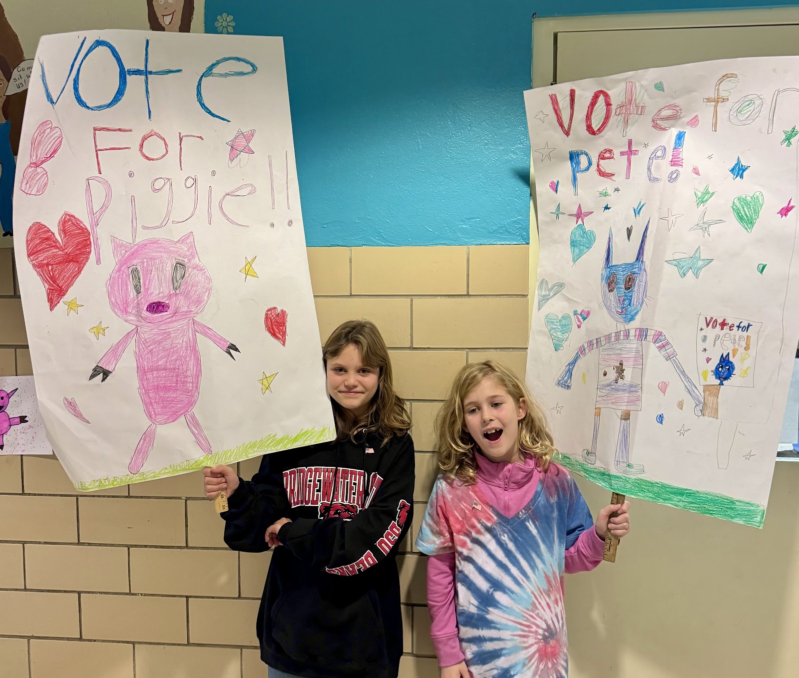 image of students holding signs for a mock election day