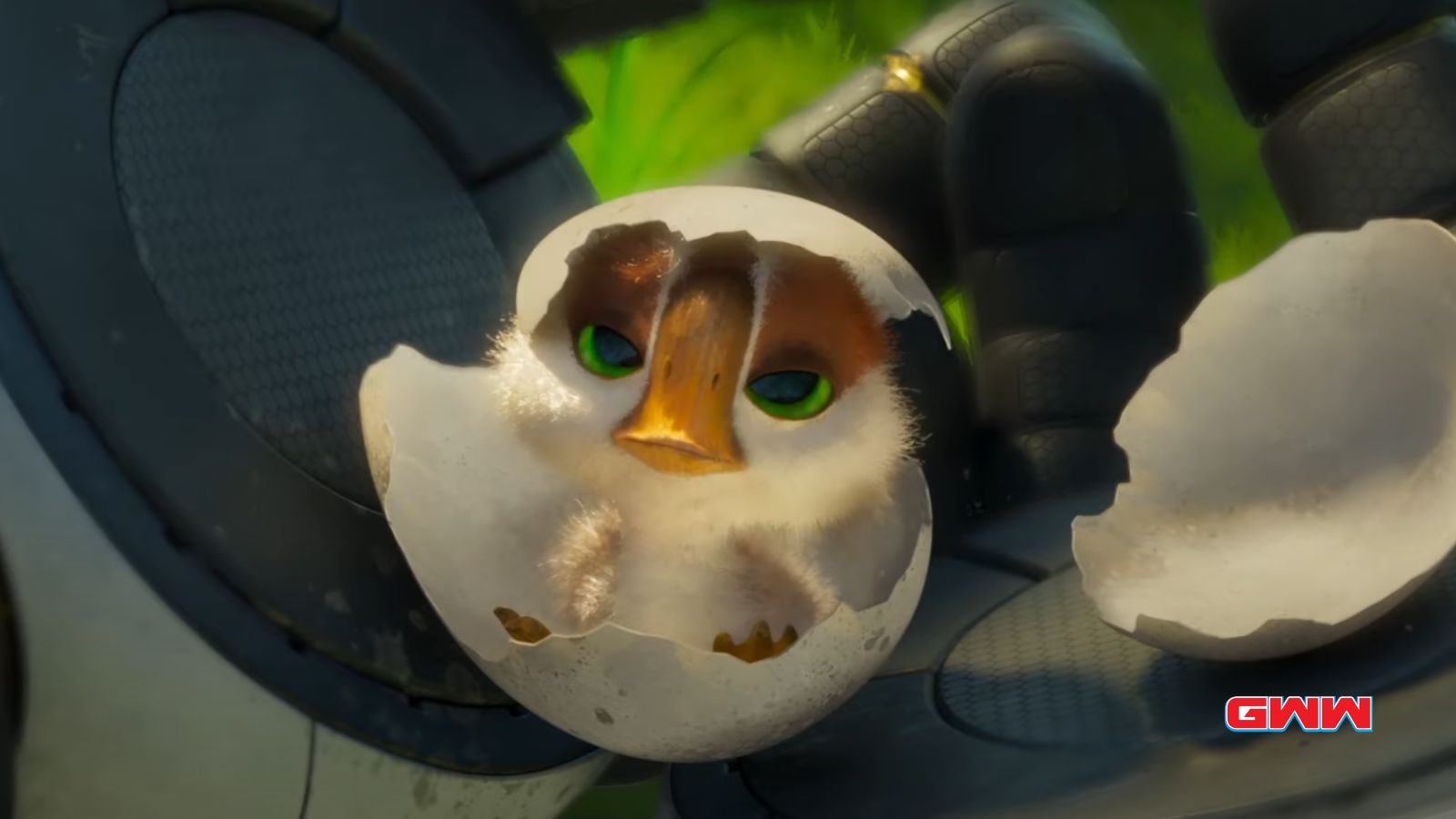 A baby bird hatching in Roz hand, bright green eyes visible.