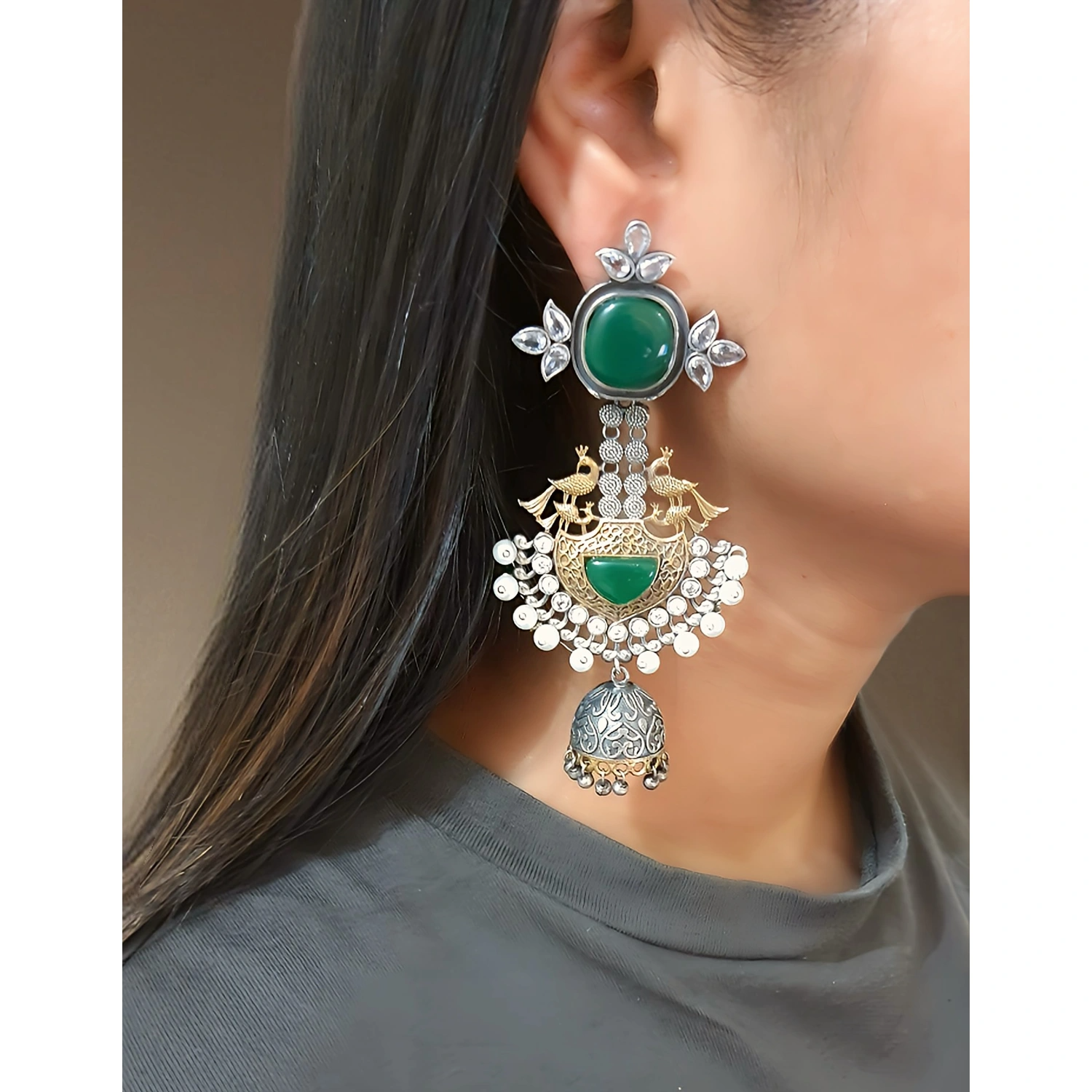 in this image the girl is wearing German Silver Geometrical Dual Tone long earring :by 
 https://thelabeldg.com/ 