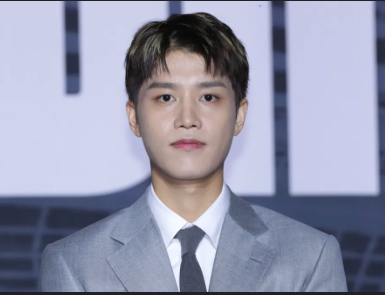 This contains an image of Taeil NCT