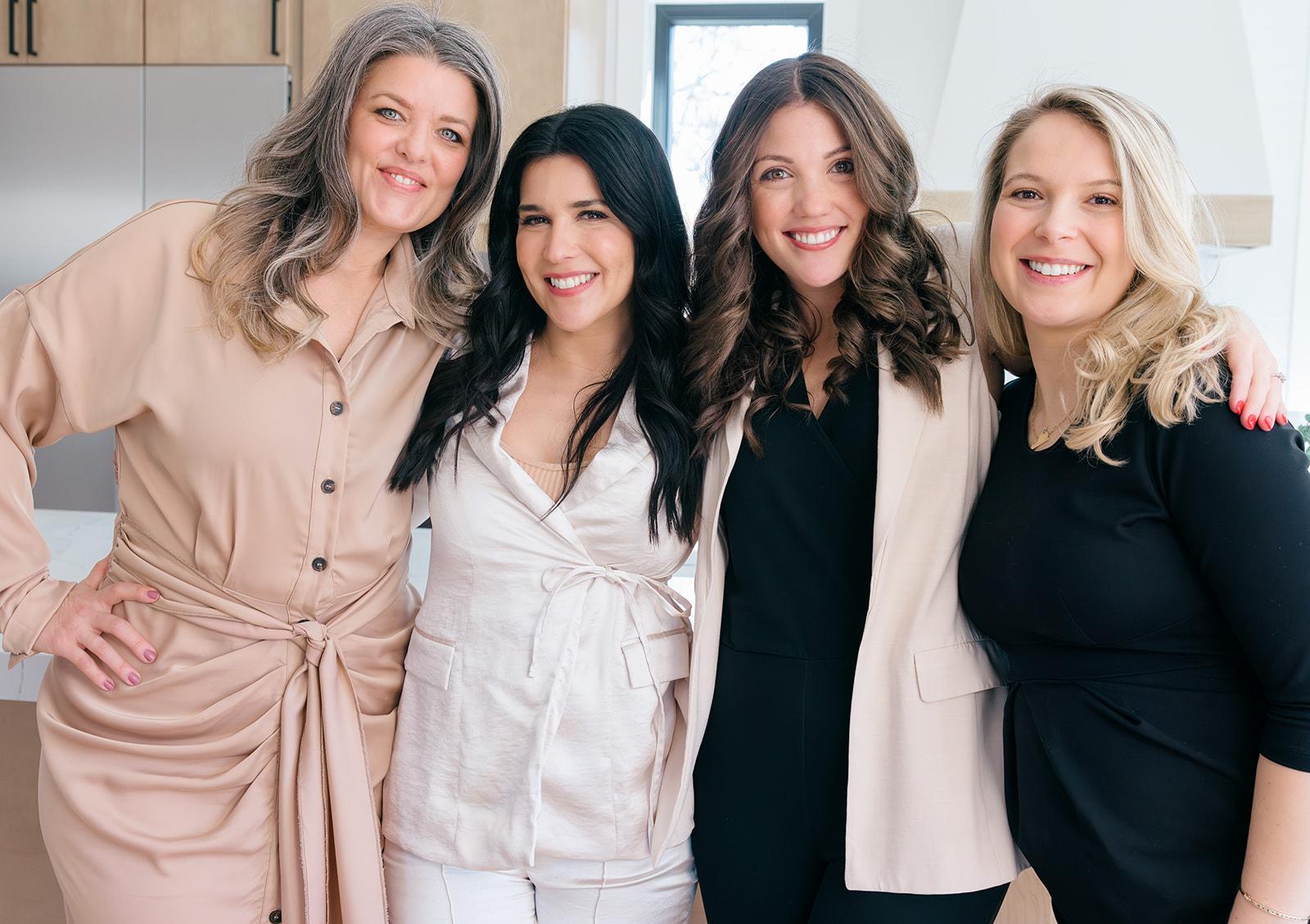 A group of women posing for a photo

Description automatically generated