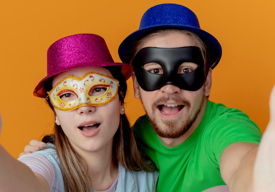 A couple capturing photos in a selfie photo booth
