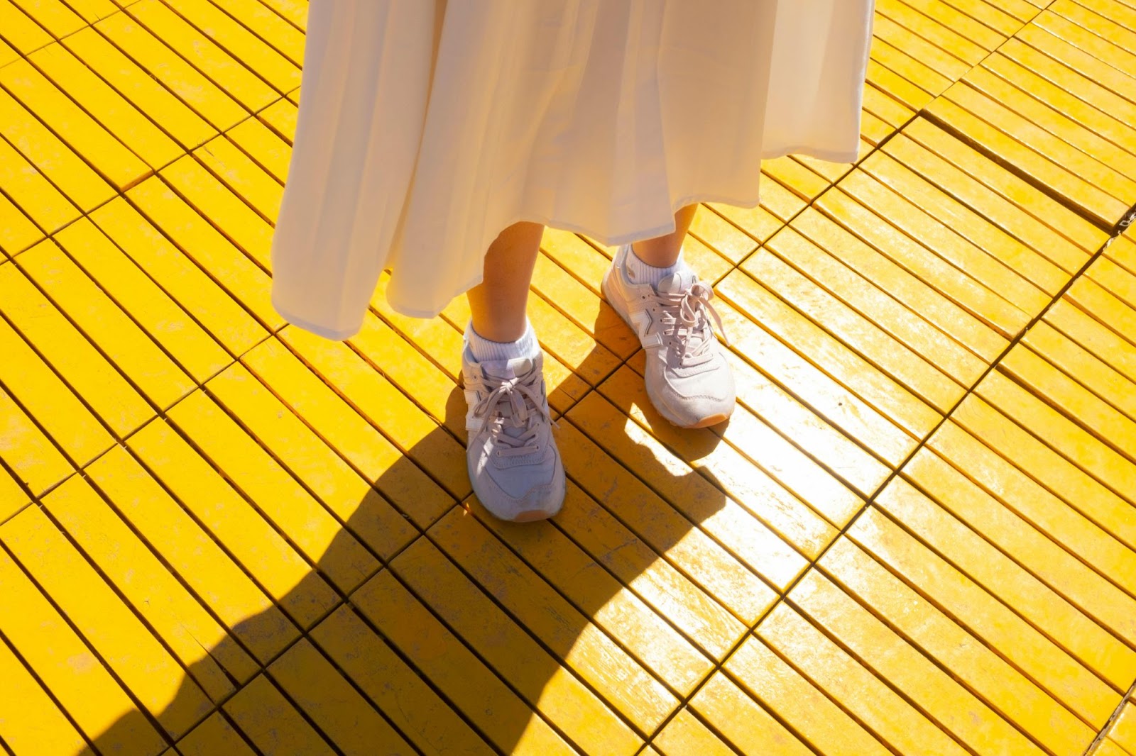 Woman in Tennis Shoes and Skirt