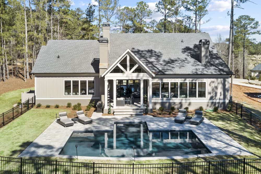 Aerial view of the country craftsman home bordered by wrought iron fence.Aerial view of the country craftsman home bordered by wrought iron fence.