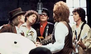 The Traveling Wilburys: Tom Petty, Bob Dylan, Roy Orbison, Jeff Lynne, and George Harrison in a 1988 recording session