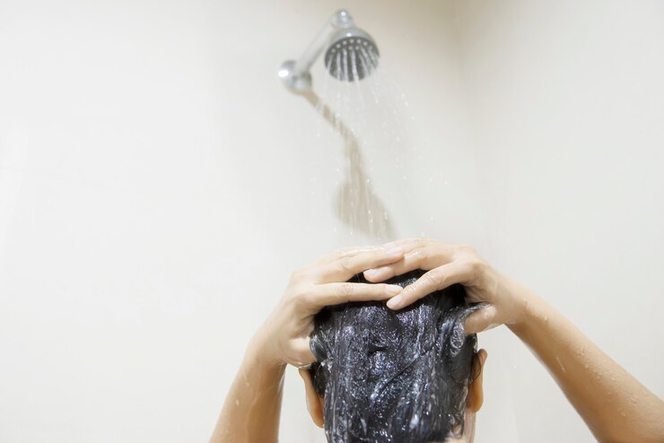 A woman washing her hair in shower