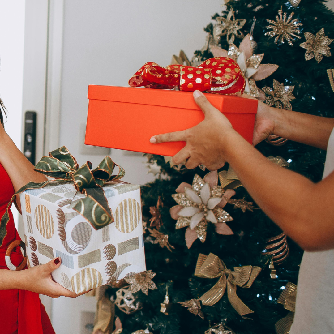 Gift swap in front of a Xmas tree