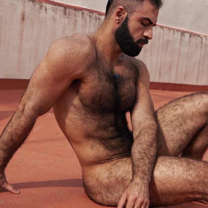 gay xxx  onlyfans creator saleh helalat showing off his hairy muscle body sitting on the ground naked