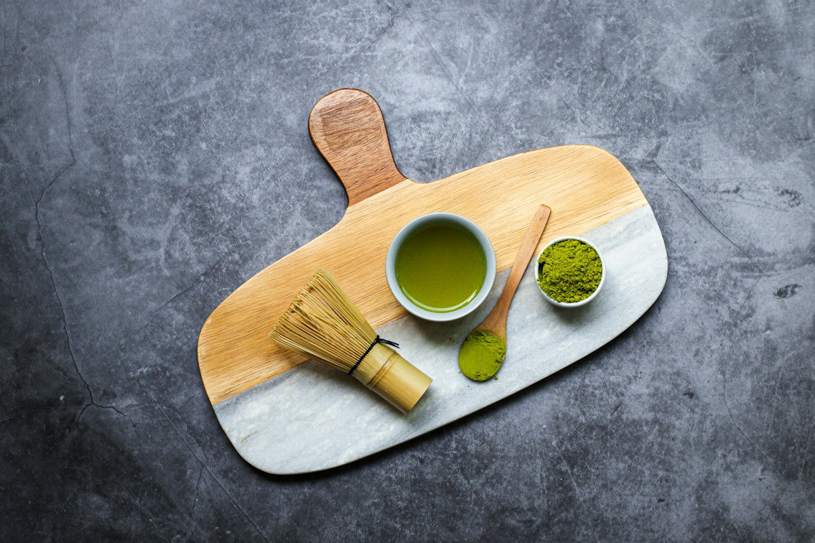 A top-down view of a serving board with green tea matcha