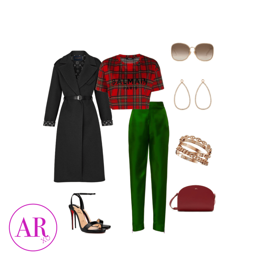 long black trench coat, red and green balmain crop top, green satin pants, gold jewelry, black heels, and brown clutch purse.