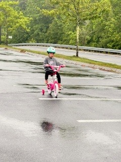 A child riding a bike

AI-generated content may be incorrect.