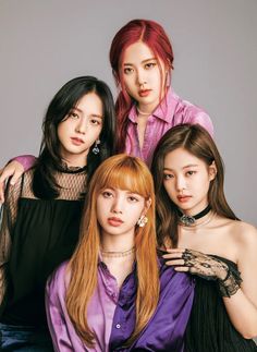 This contain BLACKPINK member posing for a photo together, one with red hair and the other wearing black