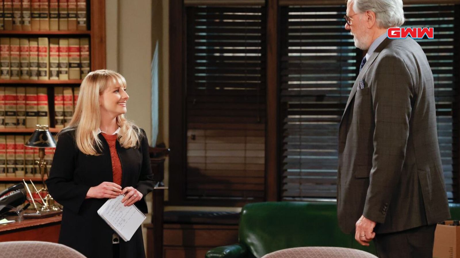 Dan Fielding and Abby Stone converse in law office, surrounded by legal books.