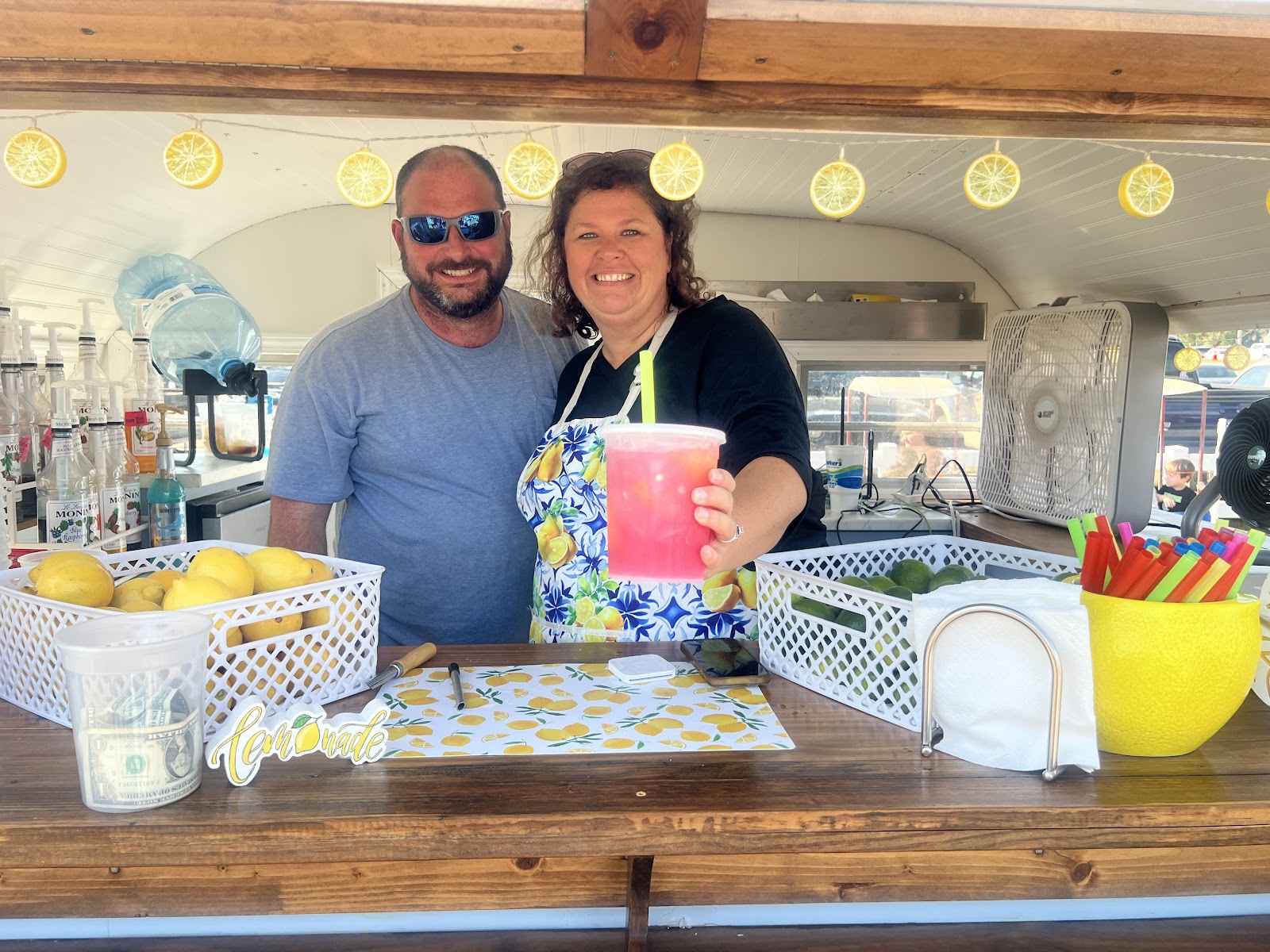 handing a lemonade