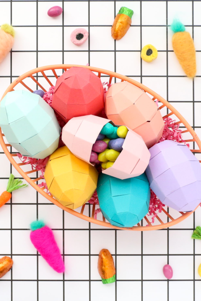 easter egg hunt ideas, pink, purple, blue, yellow and red geometric paper easter eggs with candy inside