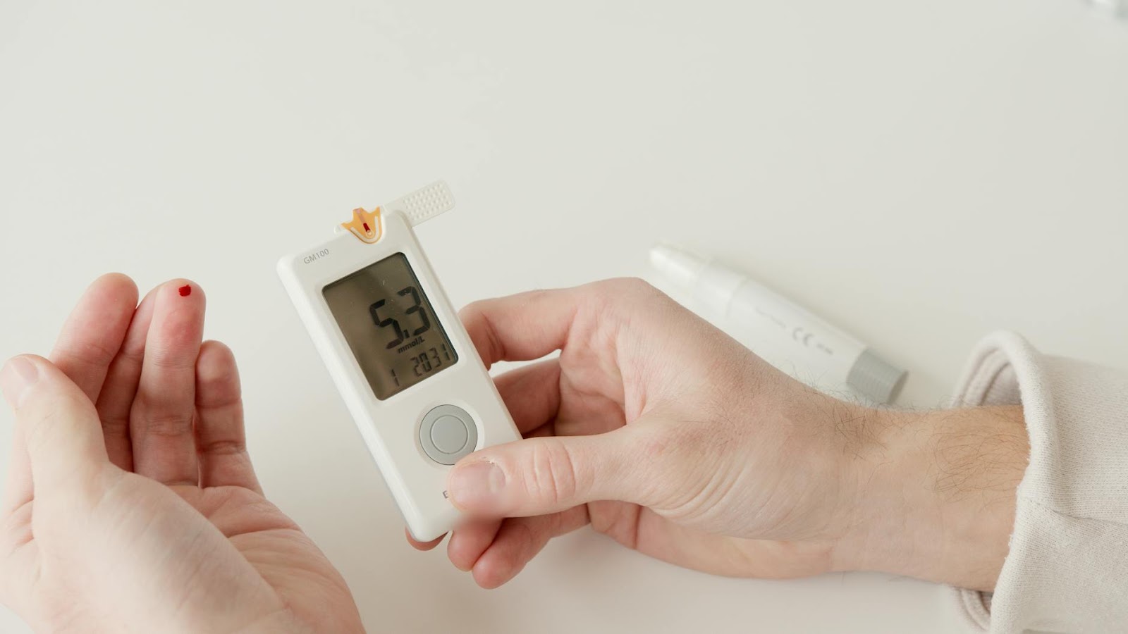 https://www.pexels.com/photo/a-person-measuring-his-glucose-blood-level-using-a-glucometer-6823509/