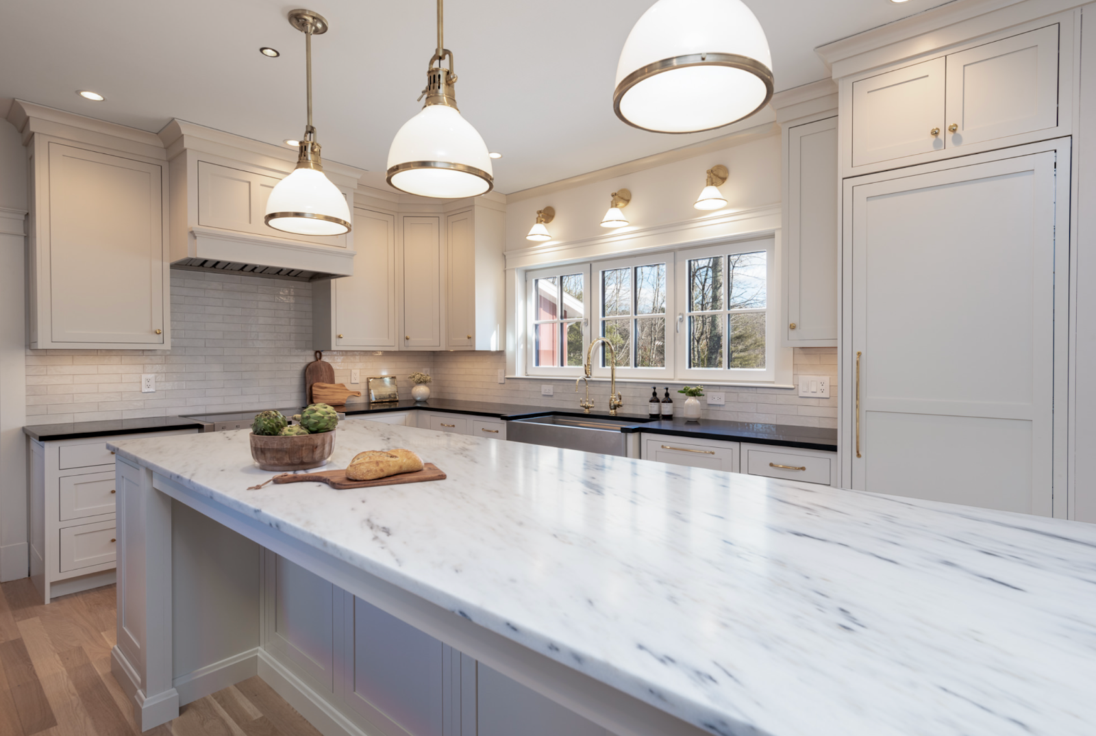 This image depicts a kitchen showcasing elegant inset cabinets, with doors that sit flush within the cabinet frame for a seamless appearance. 