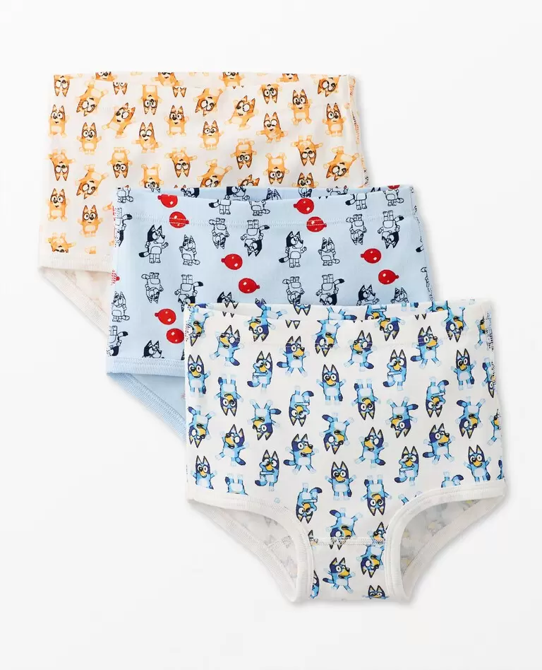 A colorful selection of Hanna Andersson organic cotton kids' underwear featuring vibrant patterns like stripes, stars, and animals.