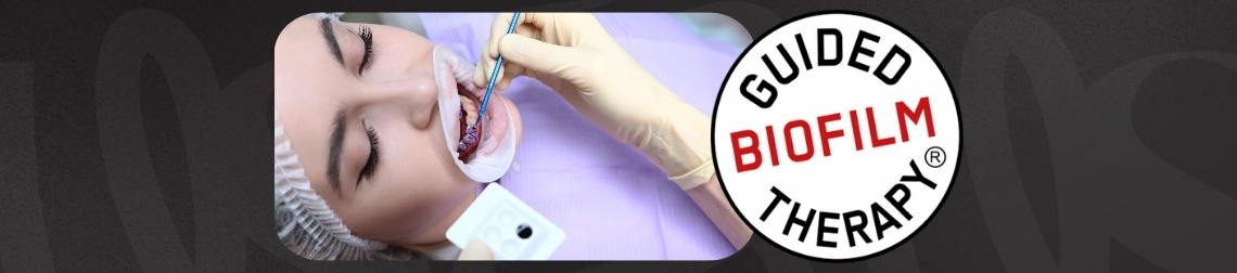 Woman receiving guided biofilm therapy treatment.