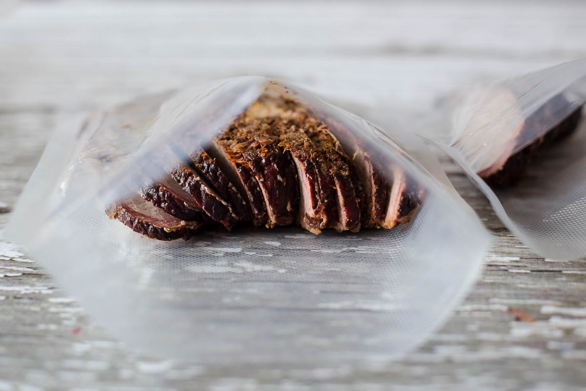 Leftover sliced bbq brisket in food vacuum bags