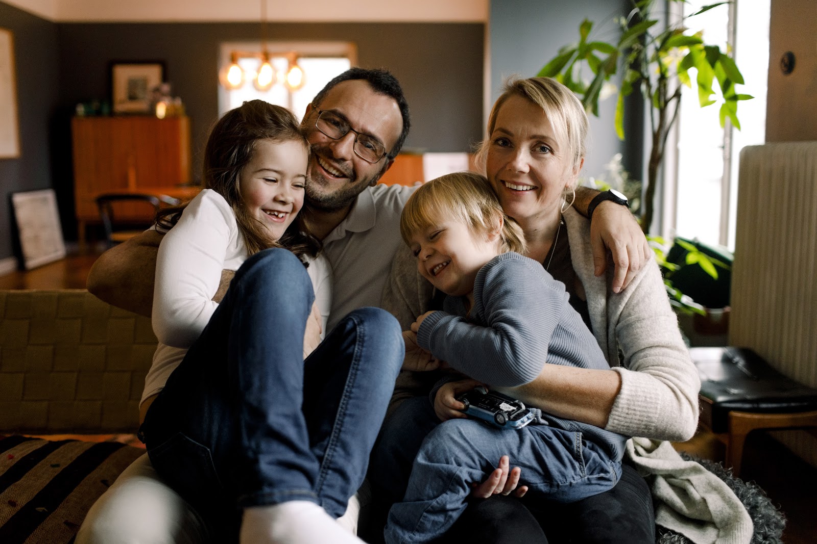 Parents with their cheerful daughters | Source: Getty Images