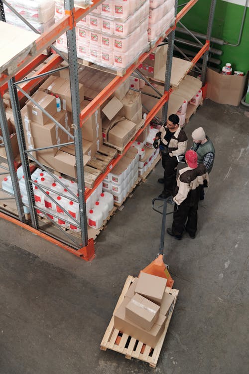 Free Men Working in a Warehouse Stock Photo