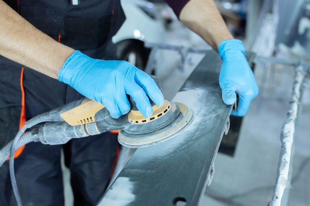 Sanding metals to remove zinc plating