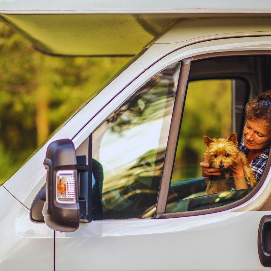 woman with dog in motorhome