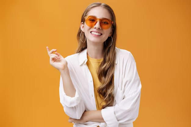 A cool and happy female in orange shades