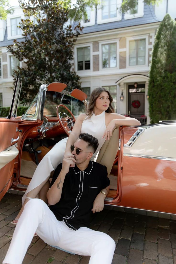 Romantic pre-wedding photoshoot of a couple in love, seated together in a vintage car