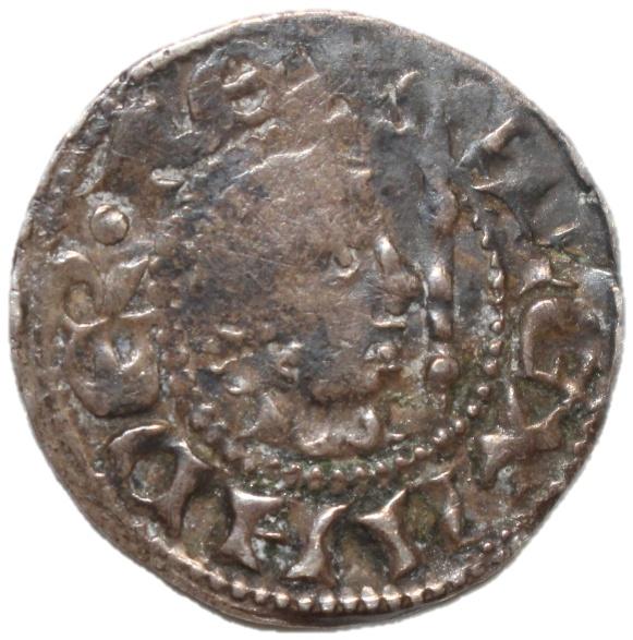 A close-up of a coin

Description automatically generated