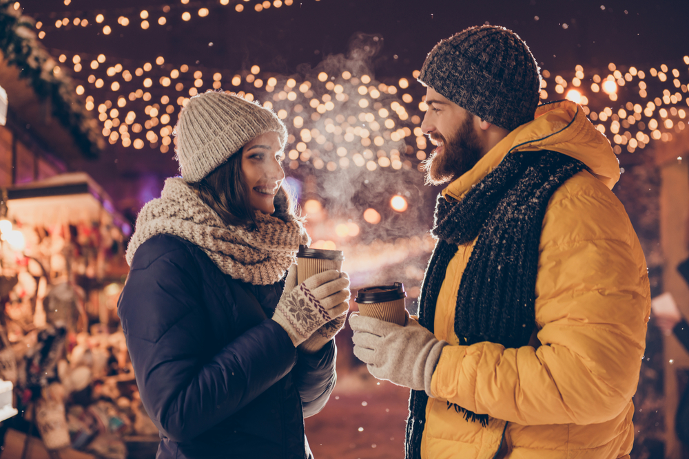 Couple dressed in warm winter clothing while on a date 