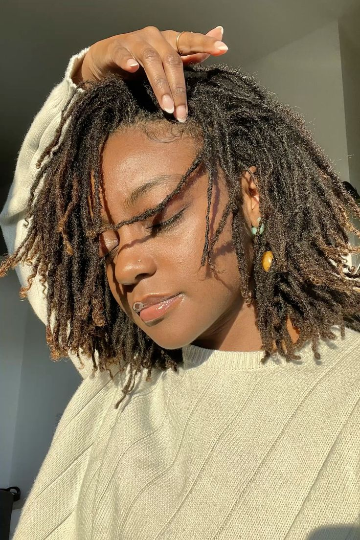 a lady showing off her large microlocs hairstyle