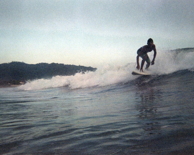 A woman surfing.