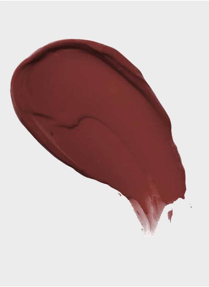 Maybelline crimson red lipstick swatch in a deep, berry-rich hue — ideal for dramatic looks with a lightweight, matte finish.