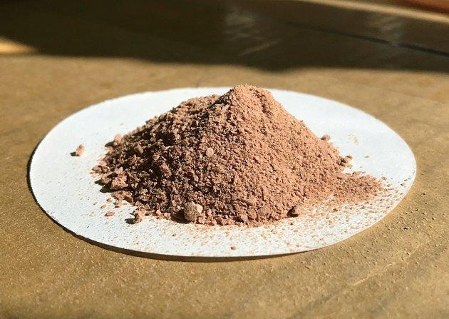 NovoNutrients fish meal - brown powder on a white sheet