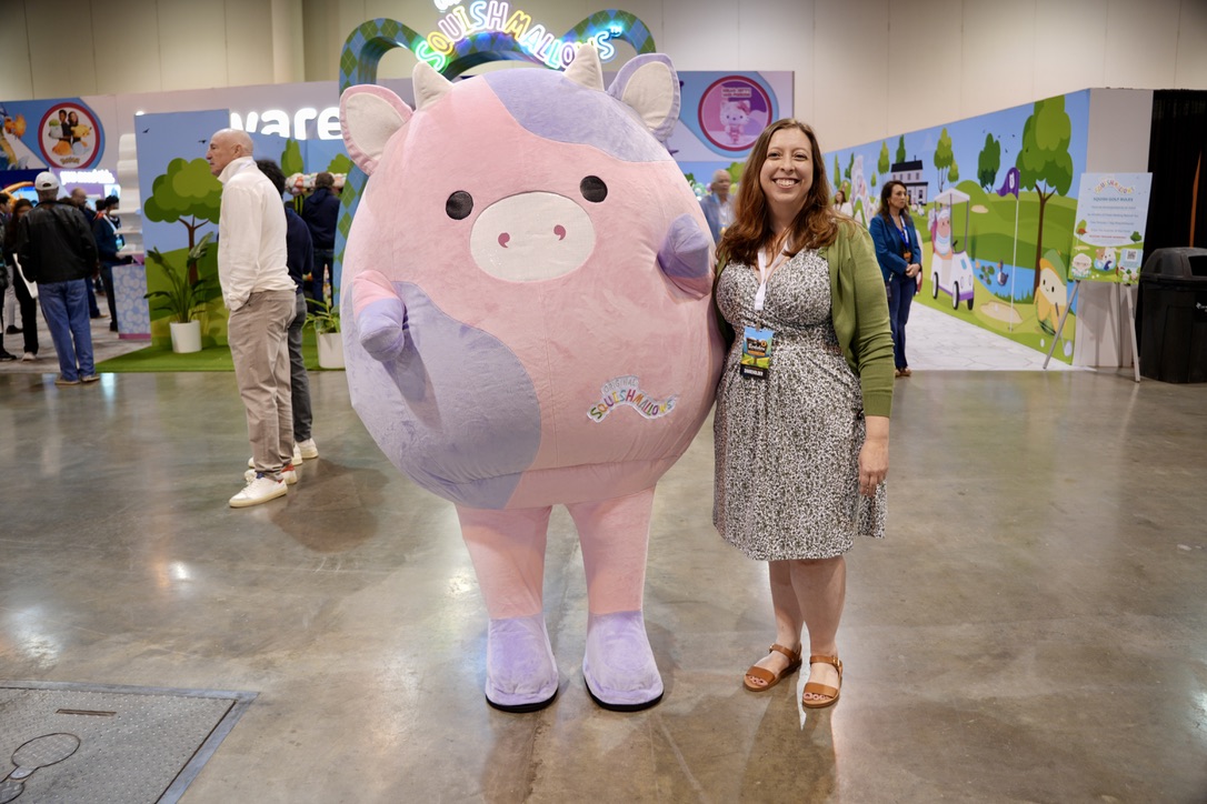 A Squishmallow mascot and a lady