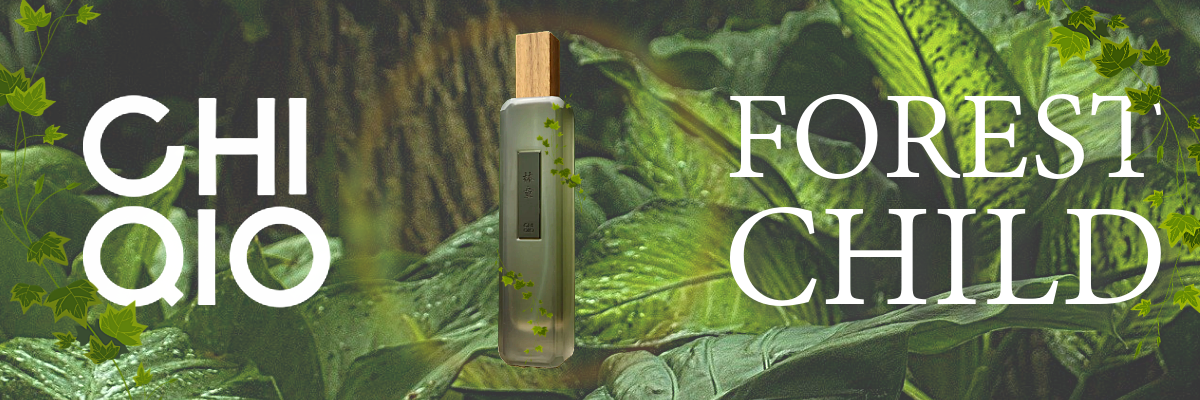 A bottle of perfume on a leafy surface

Description automatically generated