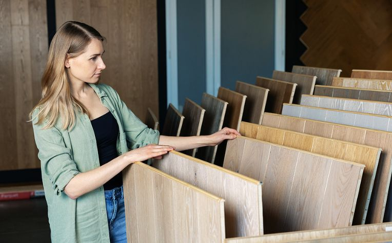 Lady looking at flooring planks