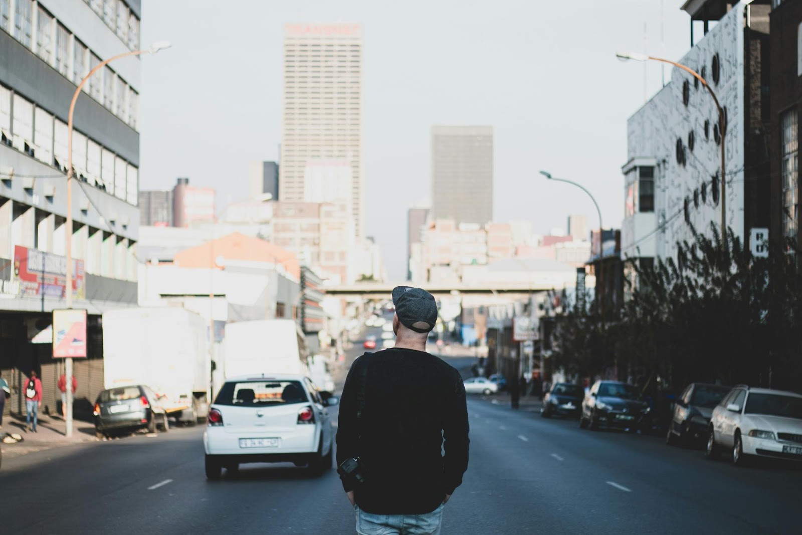a man walking on the sidewalk