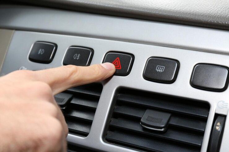 male-hand-pressing-emergency-warning-button-car-console-closeup_392895-422242.jpg