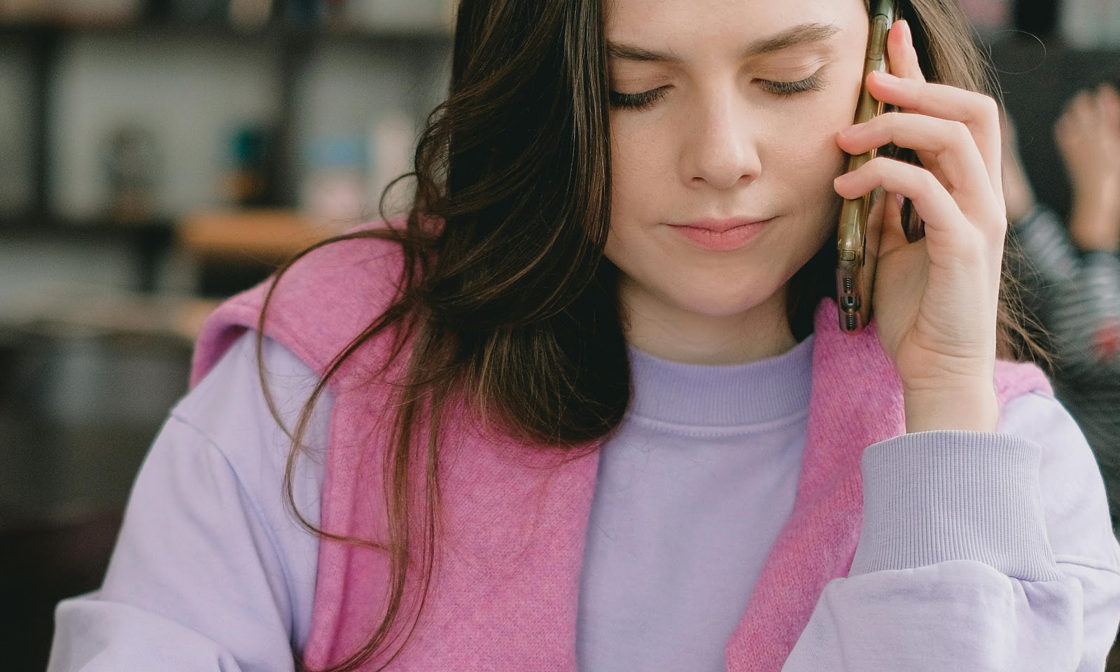 Elly calling a babysitter while trying to mask her growing suspicions | Source: Pexels