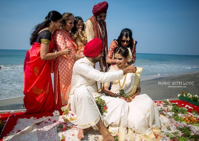 Romantic beach wedding photoshoot capturing a couple's vows by the ocean