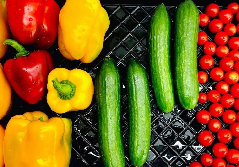 mix vegetables on the sheet red capsicum and cucumber cherry tomato
