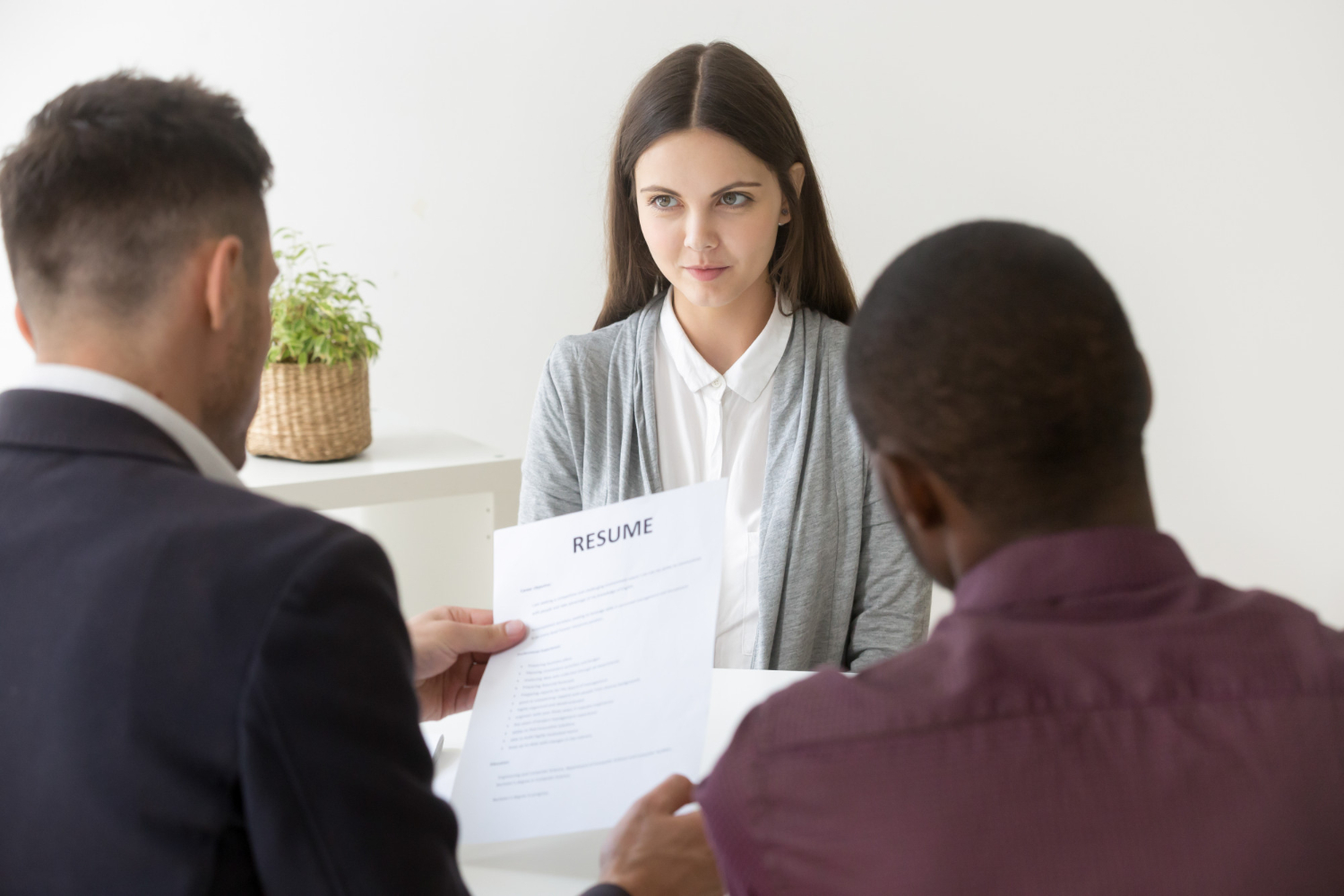 Interviewee shaking hands with the interviewer, emphasizing important interview questions to ask.