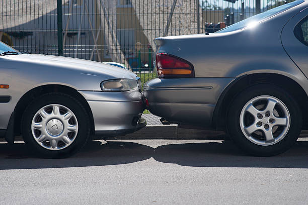  Two cars standing back to back, showcasing their bumpers.