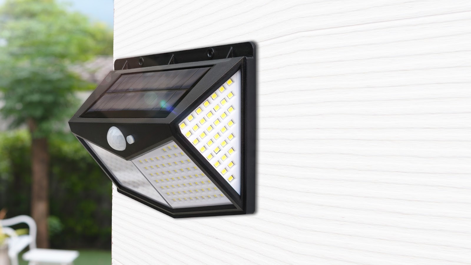 A motion-sensor light on the garage wall