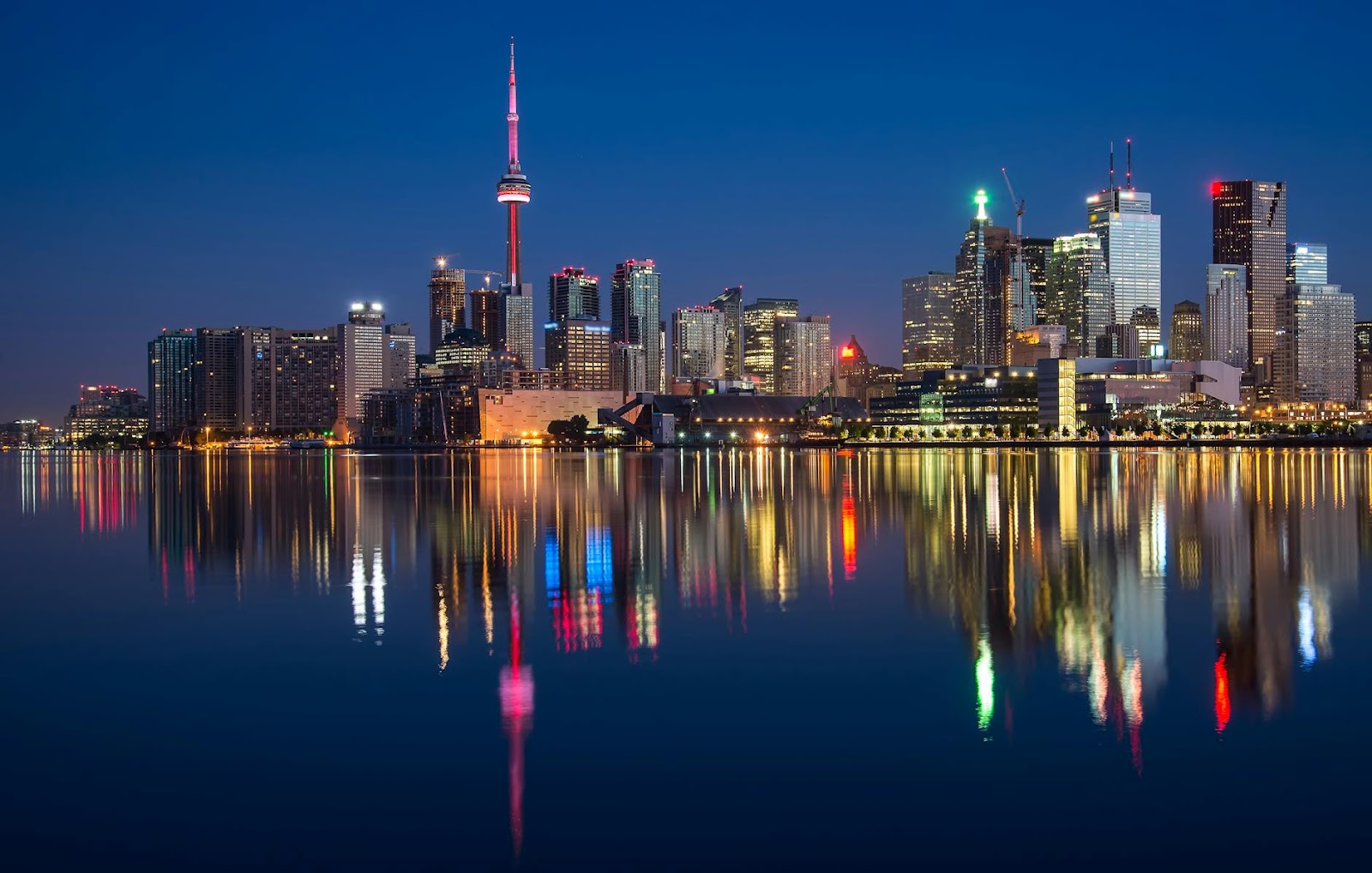 https://www.pexels.com/photo/buildings-near-body-of-water-at-night-1519088/