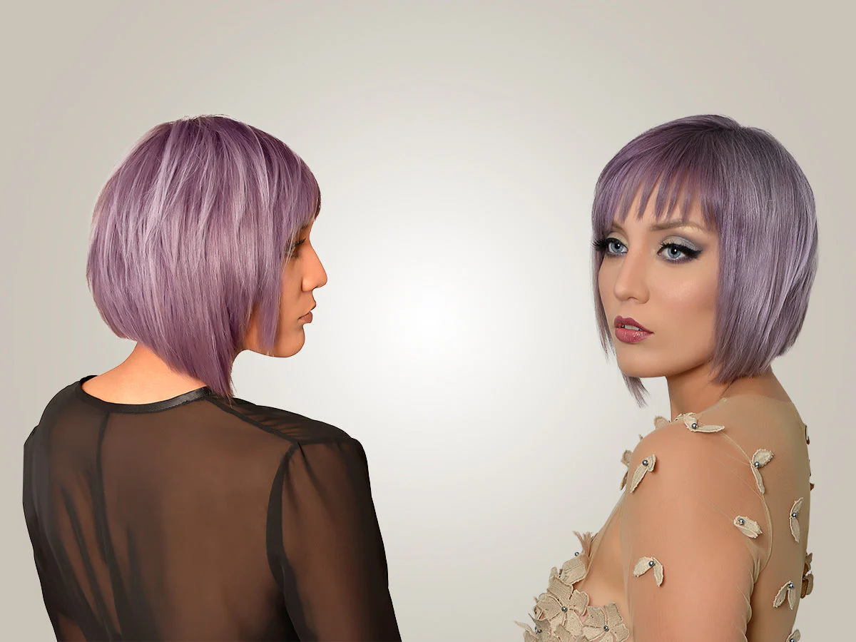 A lady rocking a sleek angled bob in soft lavender hues